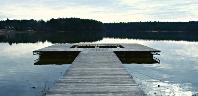 a lonely dock in lake acworth in the summertime