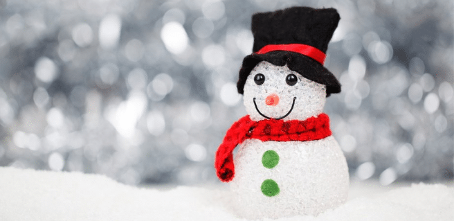 Snowman with red scarf, black hat, eyes of coal and green buttons celebrating holiday fun around atlanta