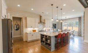 Larkspur kitchen design with red accents
