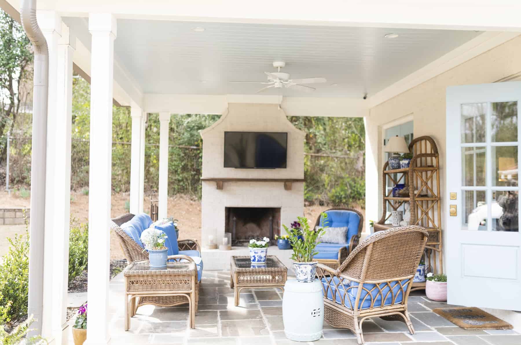 womack custom homes historic renovation outdoor living space with mounted television and seating