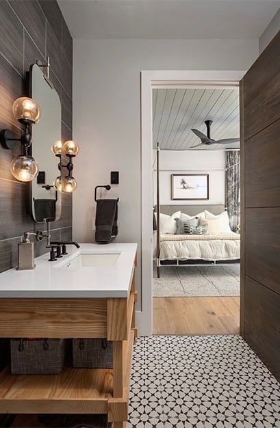 a. Gray wall tile and light gray walls and ceiling with gray and white tile bathroom floor (Crosby Design Group, Atlanta Residence)
