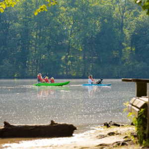 Photo of people canoeing to promote lakeside living at Sterling on the Lake.