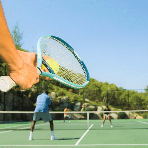 Photo of active adults playing tennis