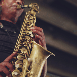 Photo of man playing a saxophone to advertise the Atlanta Jazz Festival, the kickoff to the ELEVATE Arts Festival.