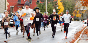 photo of runners participating in a fall 5k