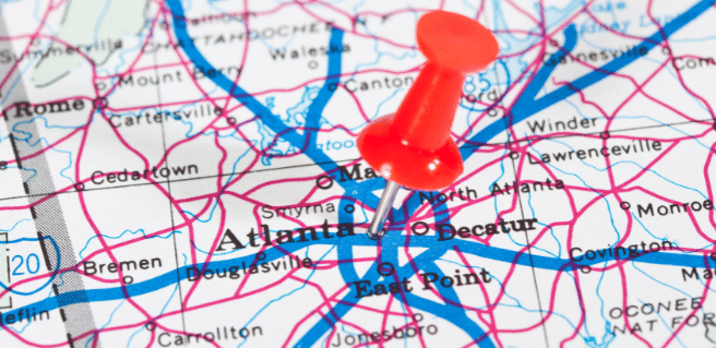 photo of georgia map with a red pin in the center to depict georgia's safest cities