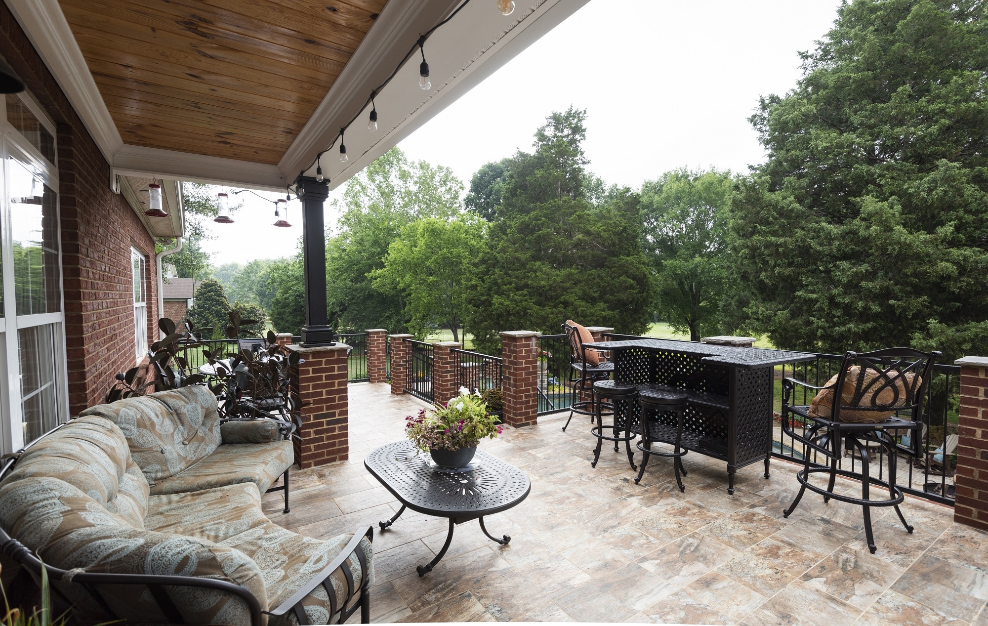 covered patio with outdoor bar by womack custom homes