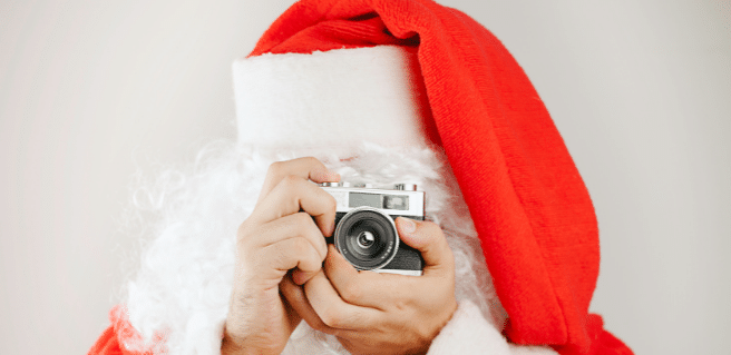 Image of Santa taking a picture. Where Can I meet Santa in Atlanta?