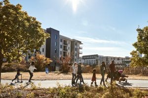 People walking on the Atlanta BeltLine with buildings behind them