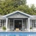 Outdoor Living Space Features Custom Pool House, Inground Pool