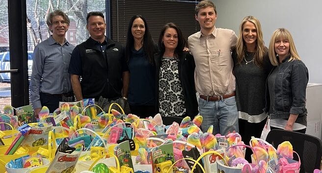 Blue River Development gives back to charity with an Easter Basket donation. Staff and baskets are pictured.