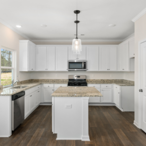 Peachtree Residential Stonegate Interior Kitchen with white cabinetry and granite countertops