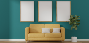 2024 Color of the Year - Teal Blue Walls with wooden floors and bright yellow couch