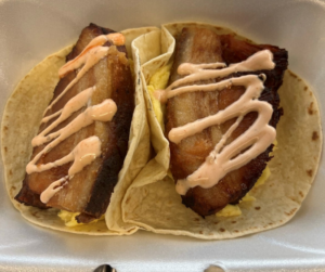 Two pork tenderloin and egg breakfast tacos prepared by Southern Grace at Chamblee Food Hall