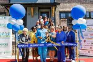 Artisan Built Communities team cutting the Grand Opening ribbon for Serenity in Hapeville