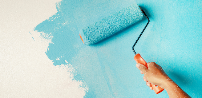 Painter Painting a White Wall Blue