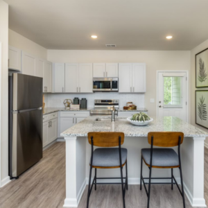 The Cottages at Walker Ridge kitchen with white cabinetry and granite countertops