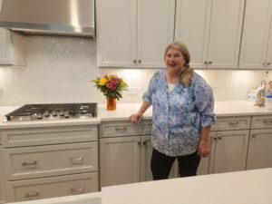 Gayle Guht in her new kitchen by Kolter Homes in Oak Hill Reserve