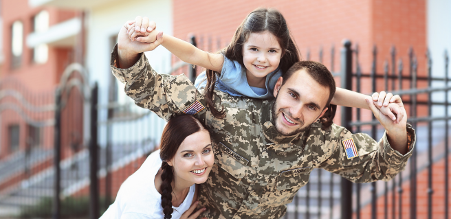 A veteran with his wife and daughter living in one of the top cities for veterans