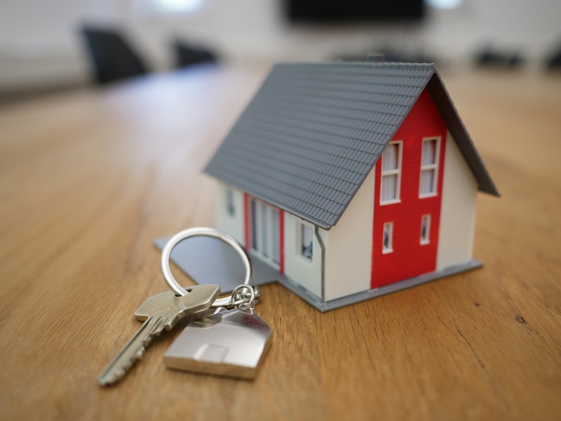 Tiny house with keys laying nearby
