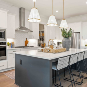 design trends kitchen with large kitchen island, pendant lighting and white tiling