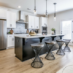 Traton Home Avenbrook Kitchen with espresso kitchen island and white cabinetry