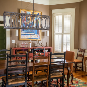 dining room with warm color tones and mismatched dining set