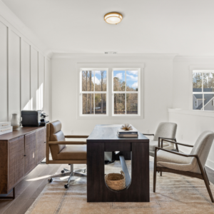 loft office space with large windows and white walls in Arden on Lanier model home
