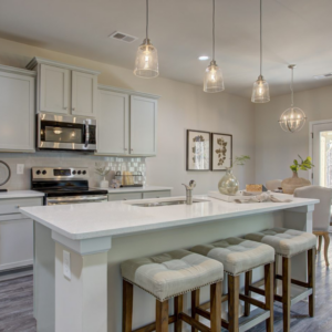 Statham Place kitchen interior with white countertops and pendant lighting